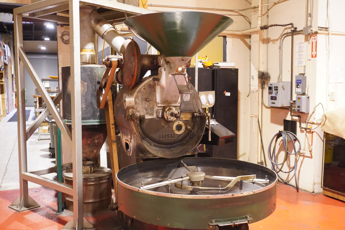 The House team beside the Probat roaster at the Seventh Street roastery