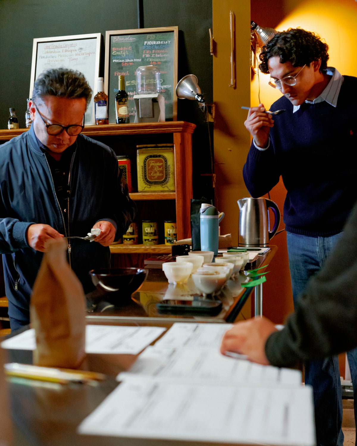 The House team cupping coffee at the roastery bar