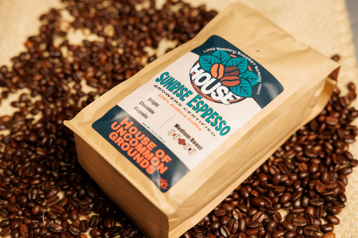 A Sunrise Espresso bag on a bed of roasted beans